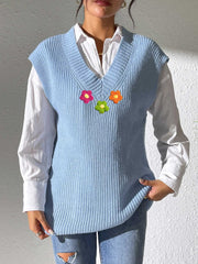 Light blue ribbed knit vest with embroidered flowers and V-neck.