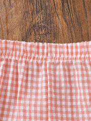 Baby gingham ruffle shorts in pink cotton with elastic waist