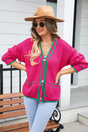 Hot Pink acrylic cardigan with green trim and pockets, V-neck, button front.