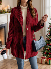 Crimson plaid single-button tailored overcoat with a notched lapel, worn open over a cream turtleneck and jeans.