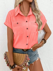 Coral polyester button-down shirt with pleated yoke and chest pockets.
