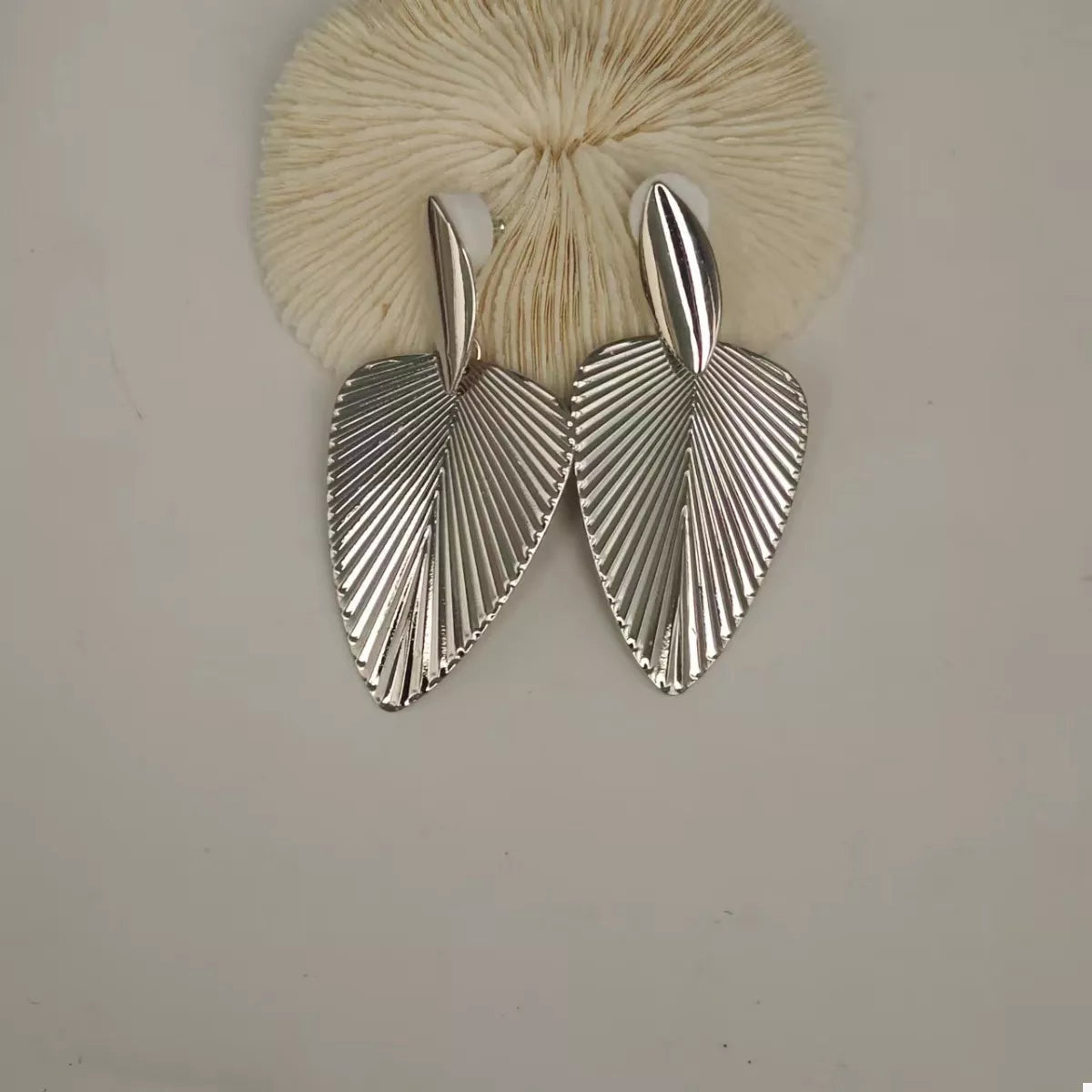 Silver leaf silhouette dangle earrings with ribbed texture