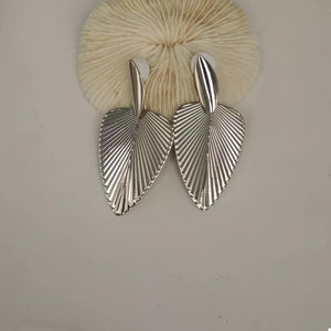 Silver leaf silhouette dangle earrings with ribbed texture