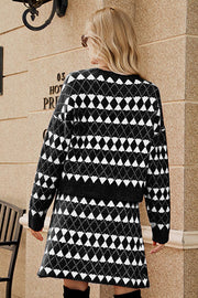 Black argyle knit cardigan and mini skirt set with buttoned front detail.