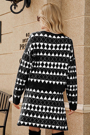 Black argyle knit cardigan and mini skirt set with buttoned front detail.