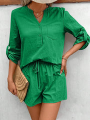 Green linen henley shirt with rolled sleeves and drawstring shorts set.
