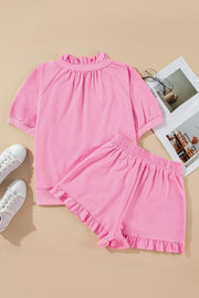 Pink cotton co-ord set with ruffled neckline and shorts.