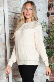 Cream ribbed knit pullover sweater with a sheer lace yoke detail.