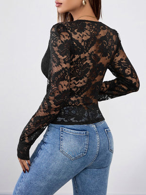 Black lace wrap bodysuit with long sleeves and scalloped trim, styled with jeans.