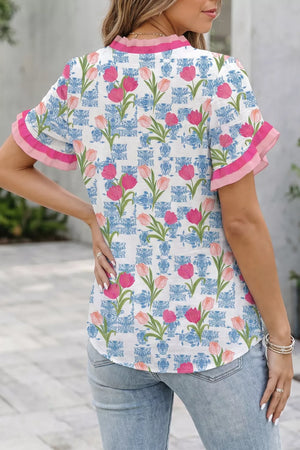 Floral ruffle v-neck tunic shirt with pink tulips and blue chinoiserie pattern.