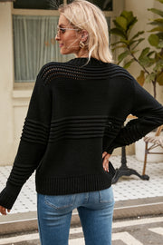 Black open-knit mock neck sweater with ribbed details and horizontal stripe pattern.