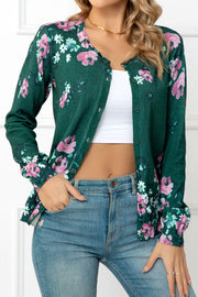 Forest green botanical print crewneck cardigan with pink flowers and white accents.