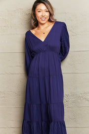 Navy backless empire waist midi dress with tiered skirt and balloon sleeves