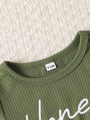 Green ribbed baby set with white script text and a size tag.