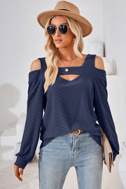 Dark blue geometric cutout shoulder top with a keyhole neckline and long sleeves.