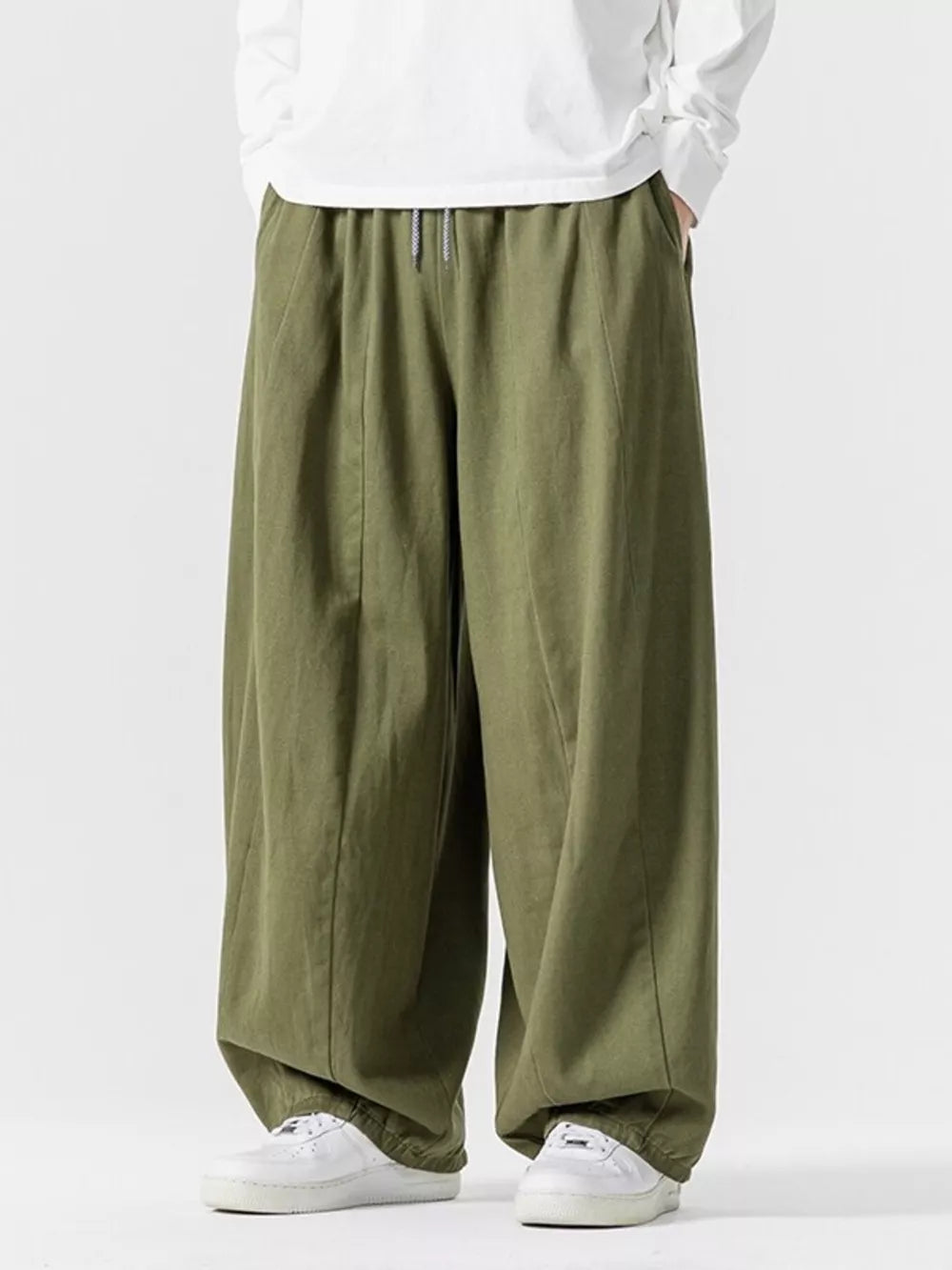 Green relaxed fit drawstring waist sweatpants with a baggy cut.