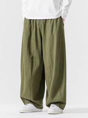 Green relaxed fit drawstring waist sweatpants with a baggy cut.
