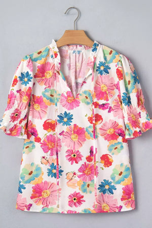 Vibrant floral print cotton blend shirt with ruched sleeves and tie-neck detail.