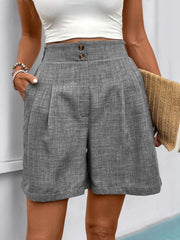 Gray high-waisted linen shorts with pleats and button detail