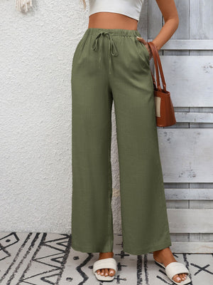 Army green high-waist wide-leg pants with drawstring and pockets.