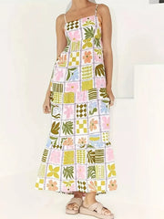 Vibrant floral print cami maxi dress with a tiered skirt and cutout back detail.
