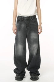 Oversized wash denim jeans in charcoal grey with a baggy fit.