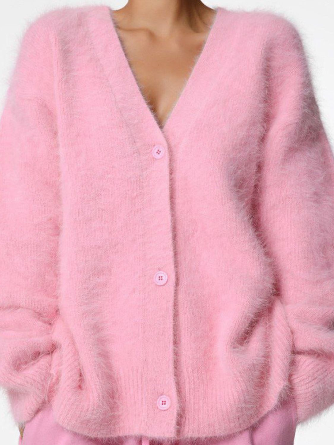 Blush pink angora button cardigan with V-neck and sculpted sleeves.