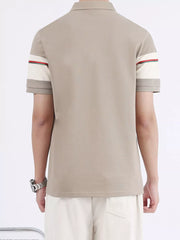 Desert color polo shirt with striped sleeve accents