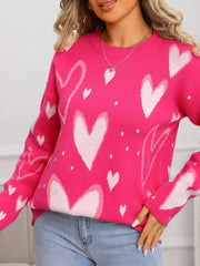 Heartfelt Fuchsia Knit Sweater with all-over white heart pattern, crew neck, long sleeves.