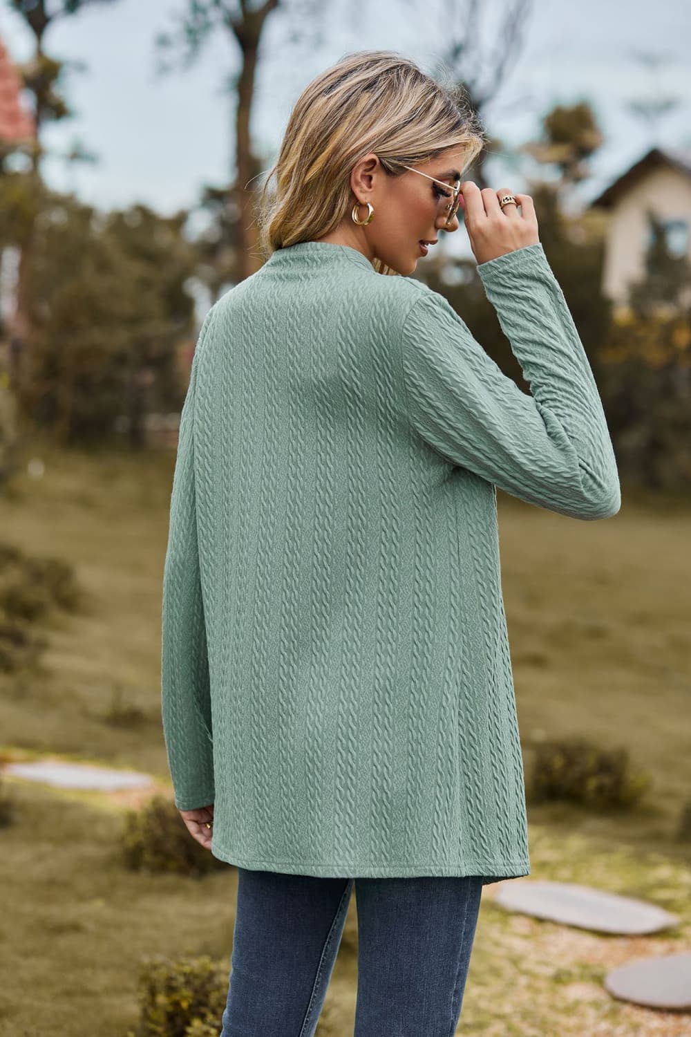 Sage textured knit cardigan with long sleeves and a mock neck, shown from the back.