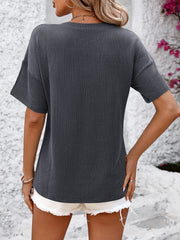 Textured ribbed charcoal v-neck tee with short sleeves and a pocket detail.