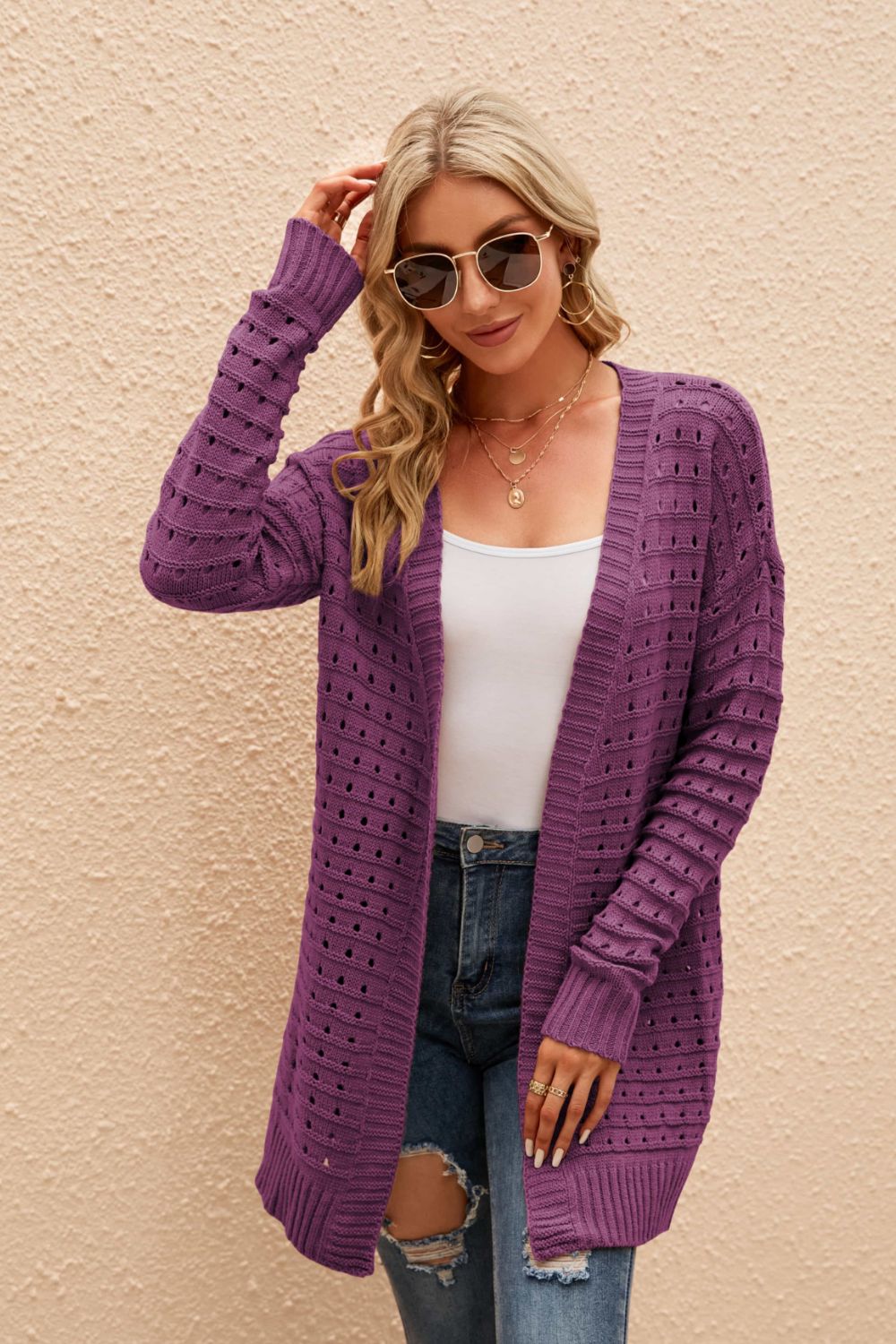 Purple perforated knit longline cardigan with open front and long sleeves.