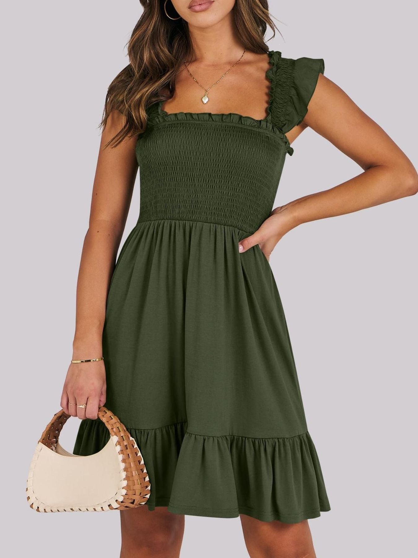 Army green smocked mini dress with ruffle hem and square neckline.