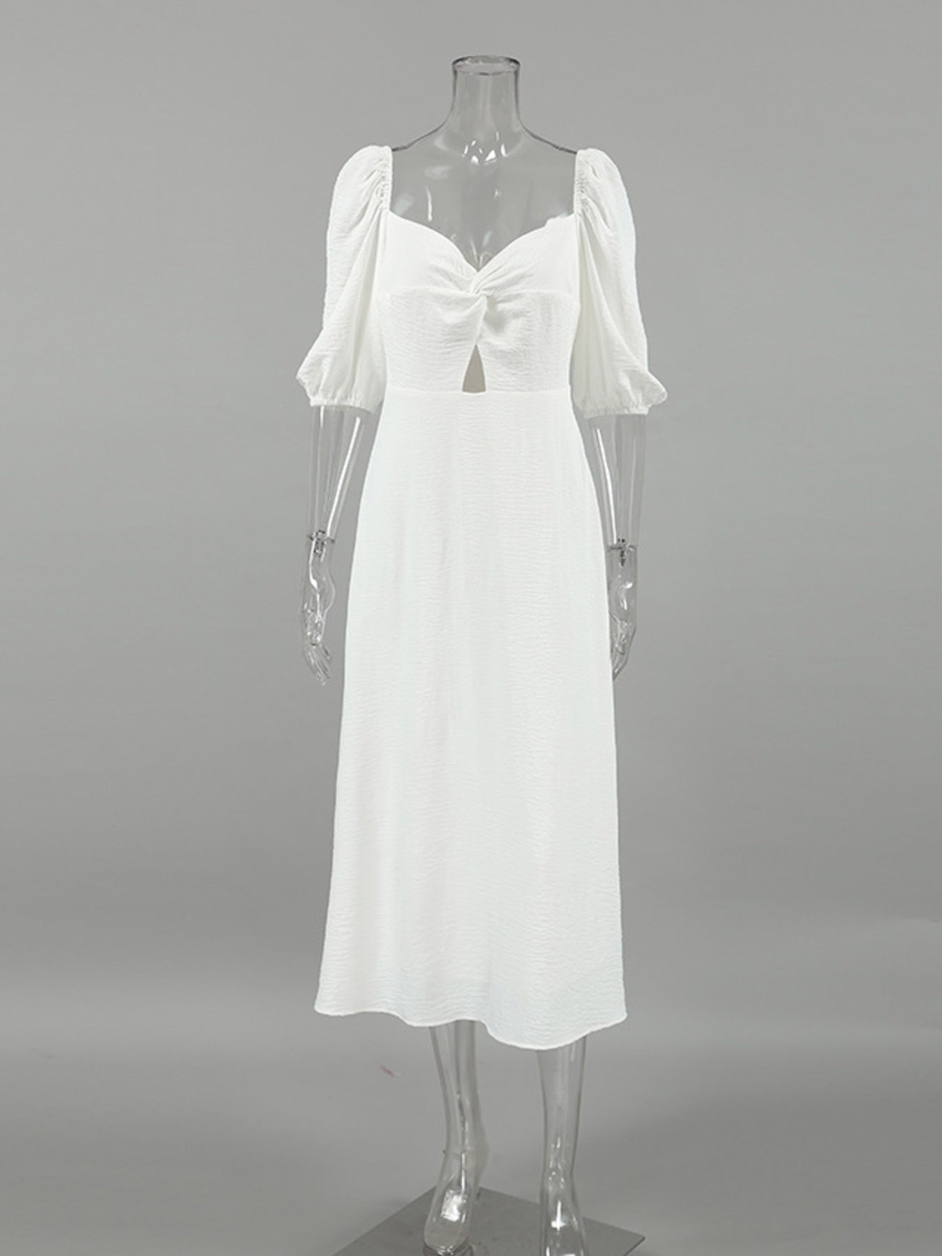 White off-shoulder midi dress with twisted sweetheart neckline and cutout detail