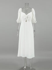 White off-shoulder midi dress with twisted sweetheart neckline and cutout detail
