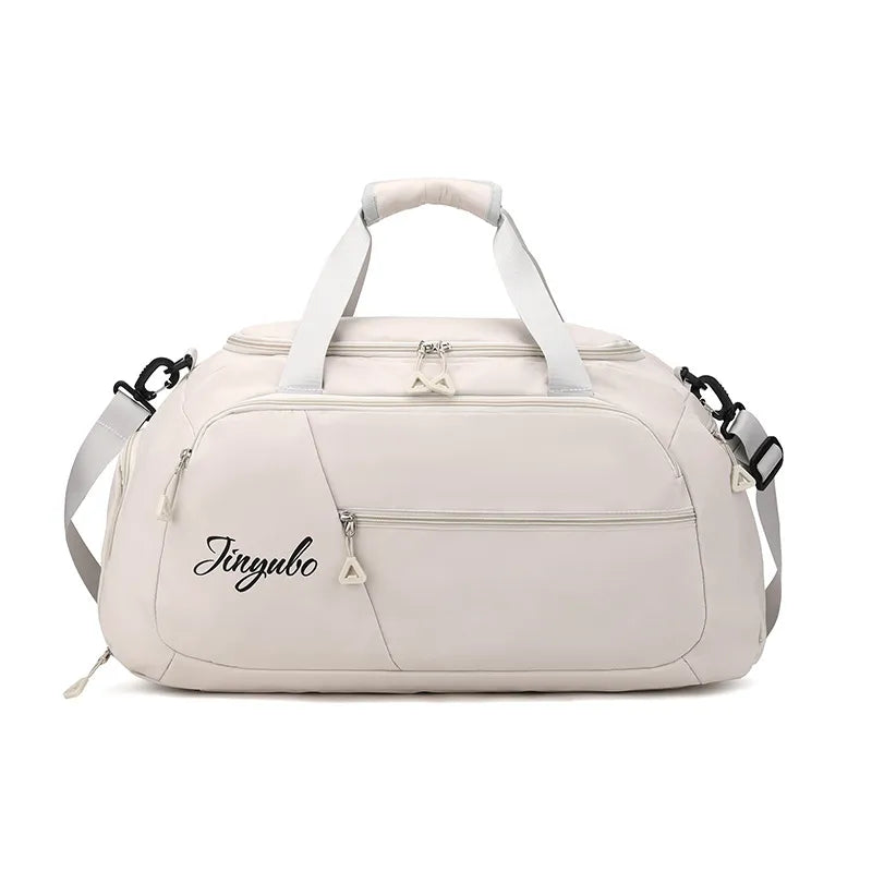 Pale Blush travel duffel bag with logo detail and multiple zippered pockets.