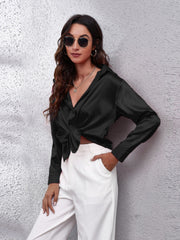 Black satin collared button-down shirt with a knot detail at the waist.