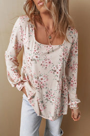 Floral print peplum blouse with square neck and long sleeves.