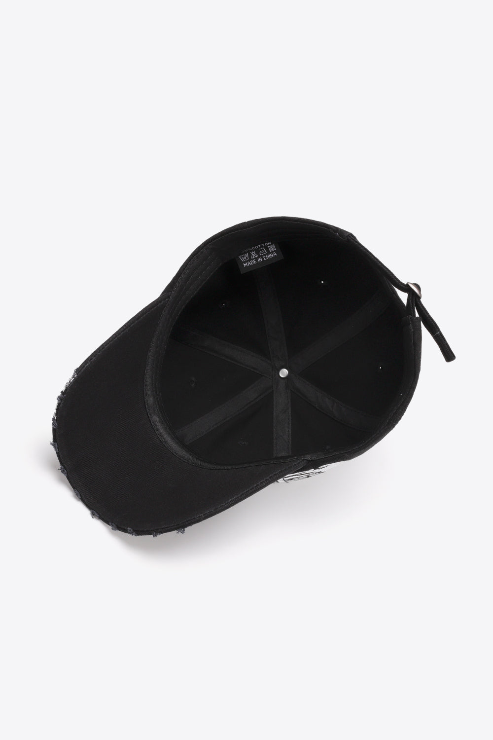 Black baseball cap with distressed brim and adjustable strap.