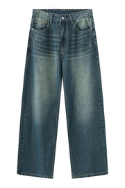 Faded wash wide-leg denim jeans in medium blue with distressed details.