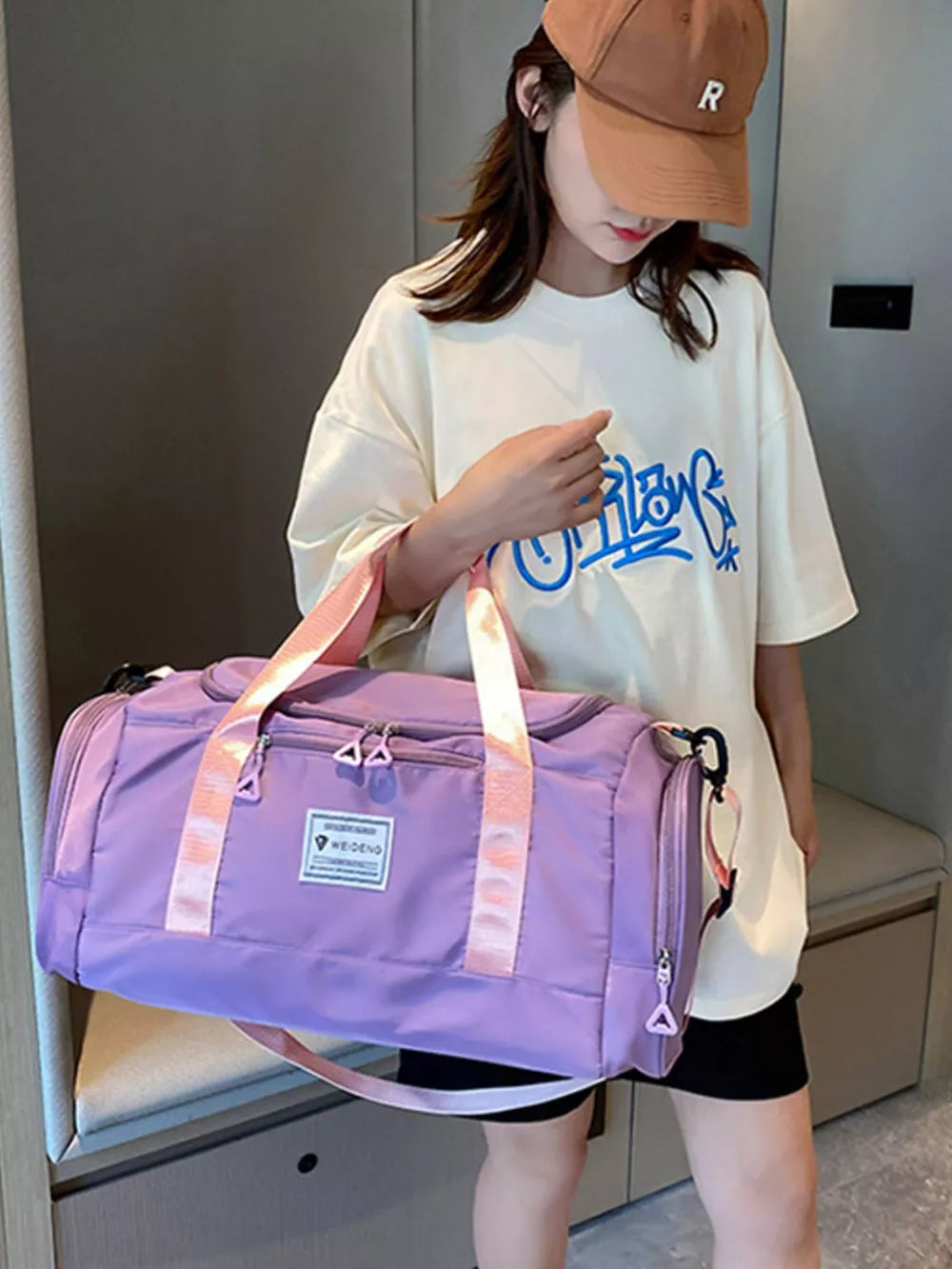 Taro Purple Oxford cloth duffle bag with pink straps and a detachable strap.
