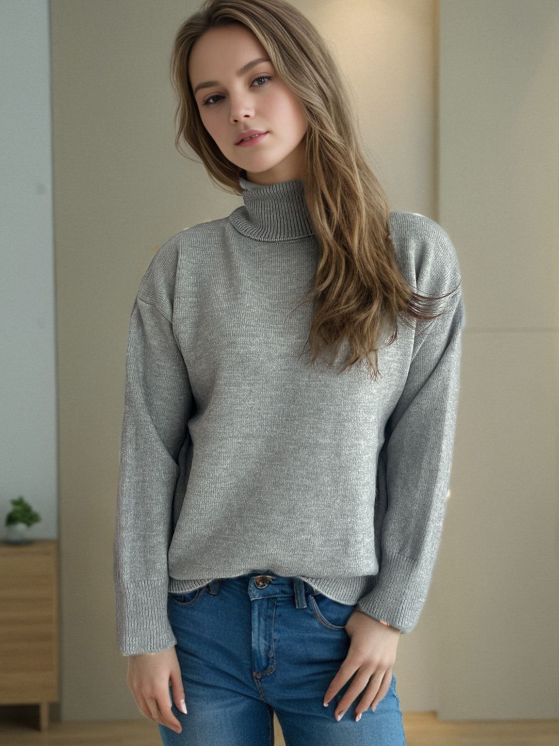 Gray relaxed fit turtleneck sweater with ribbed cuffs and neckline, acrylic blend.