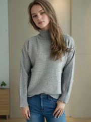 Gray relaxed fit turtleneck sweater with ribbed cuffs and neckline, acrylic blend.