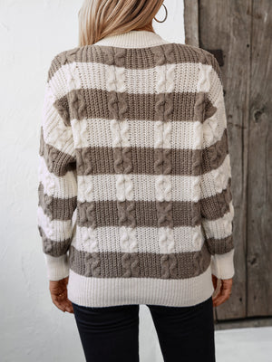 Cable knit stripe crewneck sweater in taupe and white with textured details.