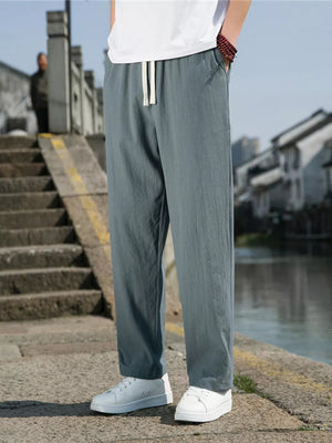 Men's light gray drawstring sweatpants with pockets