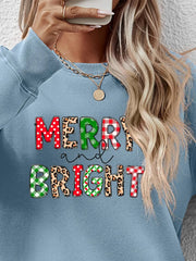 Light Blue crewneck sweatshirt with "Merry and Bright" graphic in festive patterns.