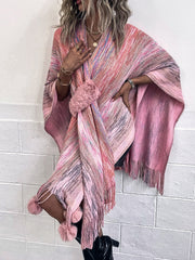 Pink multi-color knit wrap coat with fringe and pom-pom embellishments.