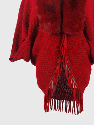 Deep Red textured knit poncho with faux fur collar and fringe detail.