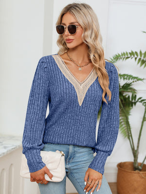 Cobalt blue ribbed knit sweater with crochet V-neck trim and long sleeves.