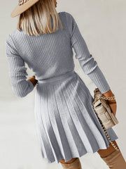 Ribbed knit wrap dress with a pleated skirt in dark gray.